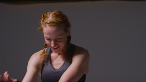 Studio-Portrait-Of-Mature-Woman-Wearing-Gym-Fitness-Clothing-Resting-And-Recovering-After-Exercise-1